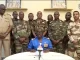 Niger army spokesman Colonel-Major Amadou Abdramane speaks on behalf of General Tchiani during an appearance on national television, after President Mohamed Bazoum was held in the presidential palace in Niamey, Niger, July 26, 2023 [ORTN via Reuters TV]