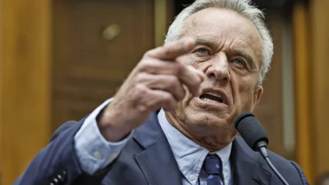 RFK angrily brandishing a finger as he gives a speech this past July.